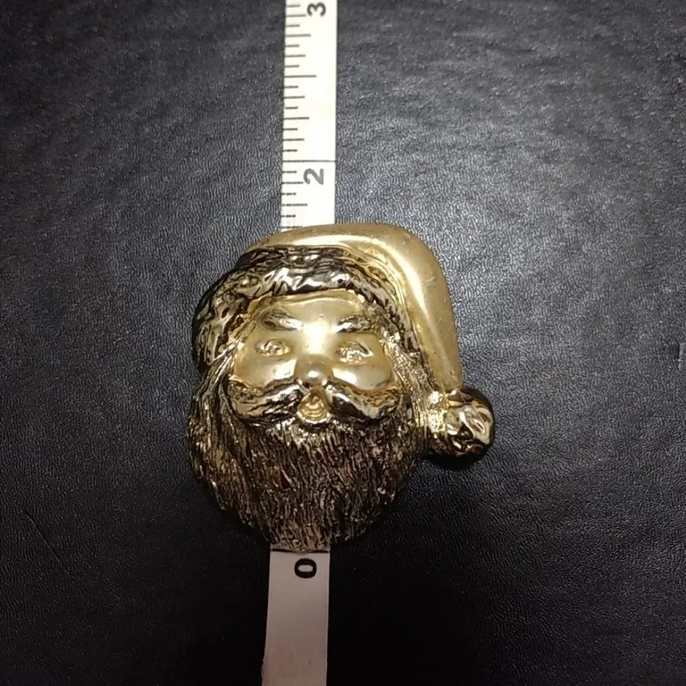 Gold tone vintage Santa Claus brooch